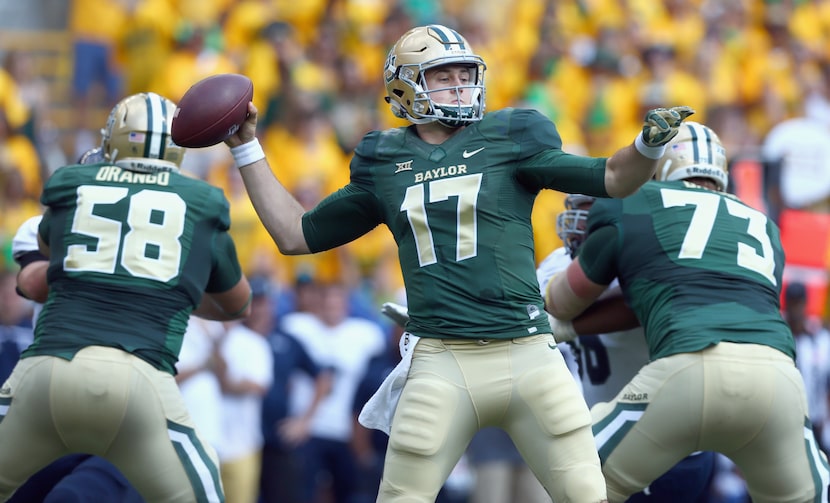 Baylor quarterback Seth Russell looks for an open receiver against Rice.  (Photo by Tom...