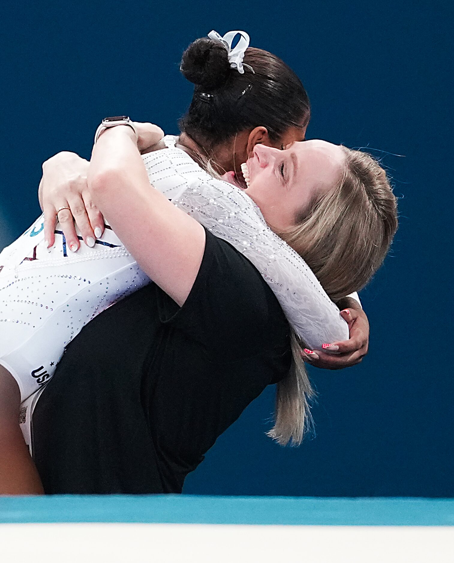 Coach Cecile Landi celebrates with Jordan Chiles of the United States after Chiles won the...