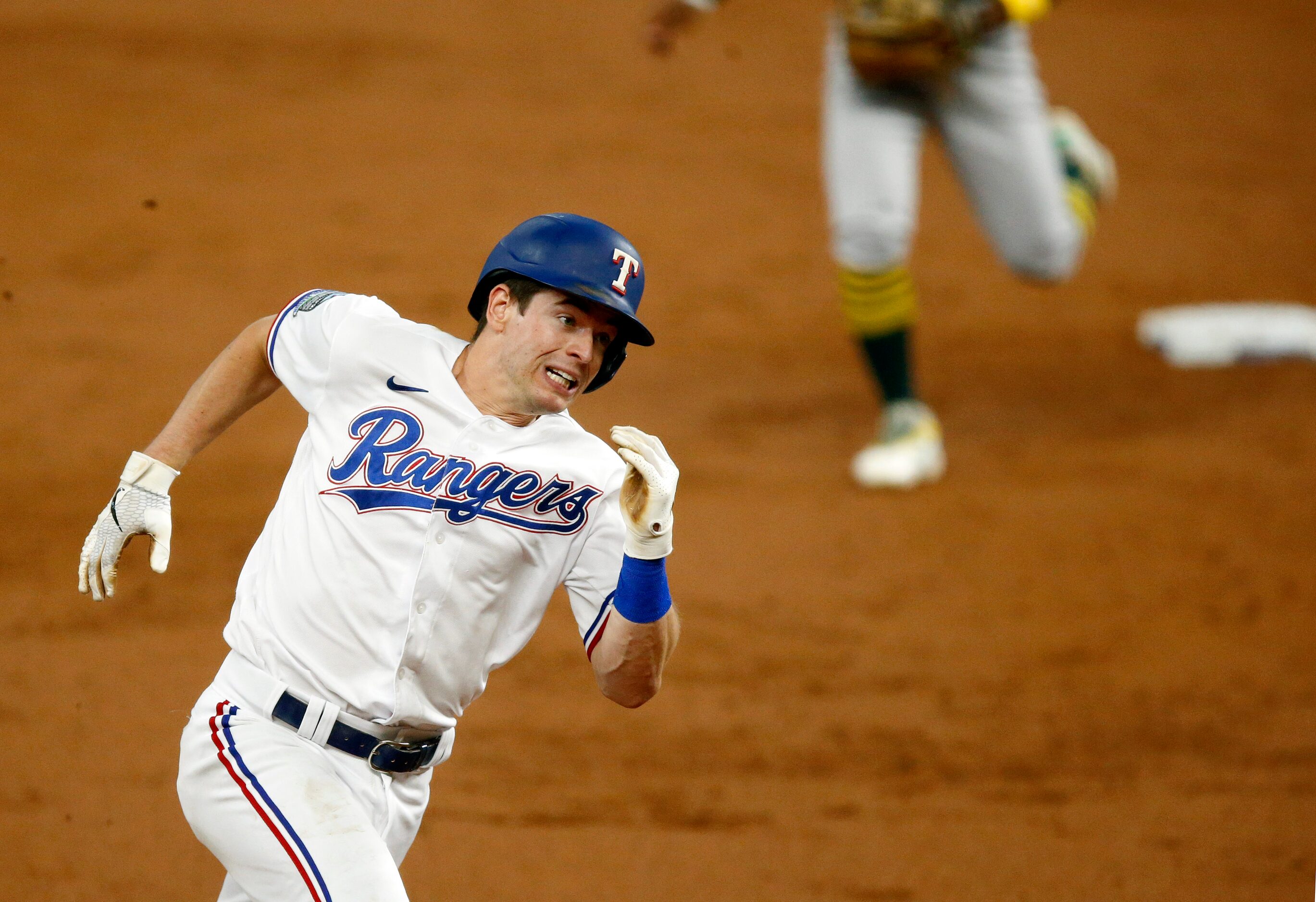 Texas Rangers Nick Solak (15) races to third on a Danny Santana double during the first...