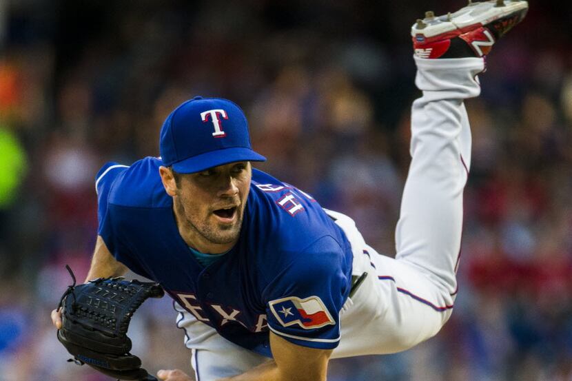 Texas Rangers starting pitcher Cole Hamels (35) pitches during the fourth inning of their...