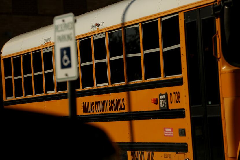 Students from J. J. Pearce High School ride on a Dallas County Schools bus following the...