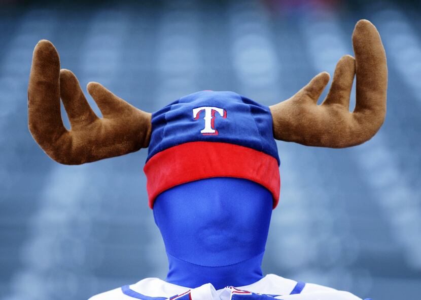 A Texas Rangers fan wears antlers before Game 6 of the American League championship series.