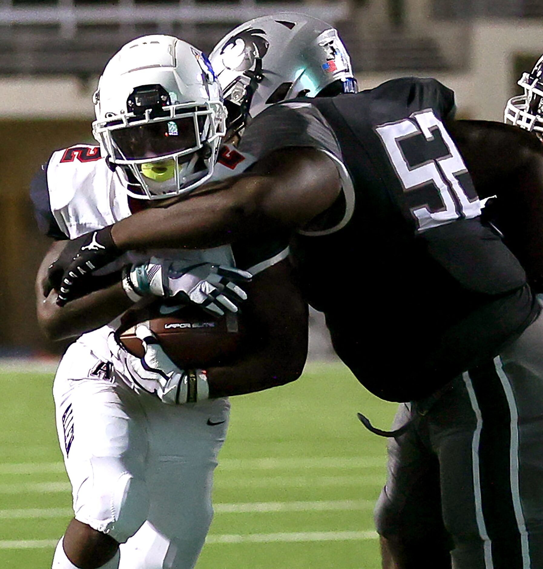 Allen running back Jaylen Jenkins (2) tries to break a tackle from Denton Guyer defensive...