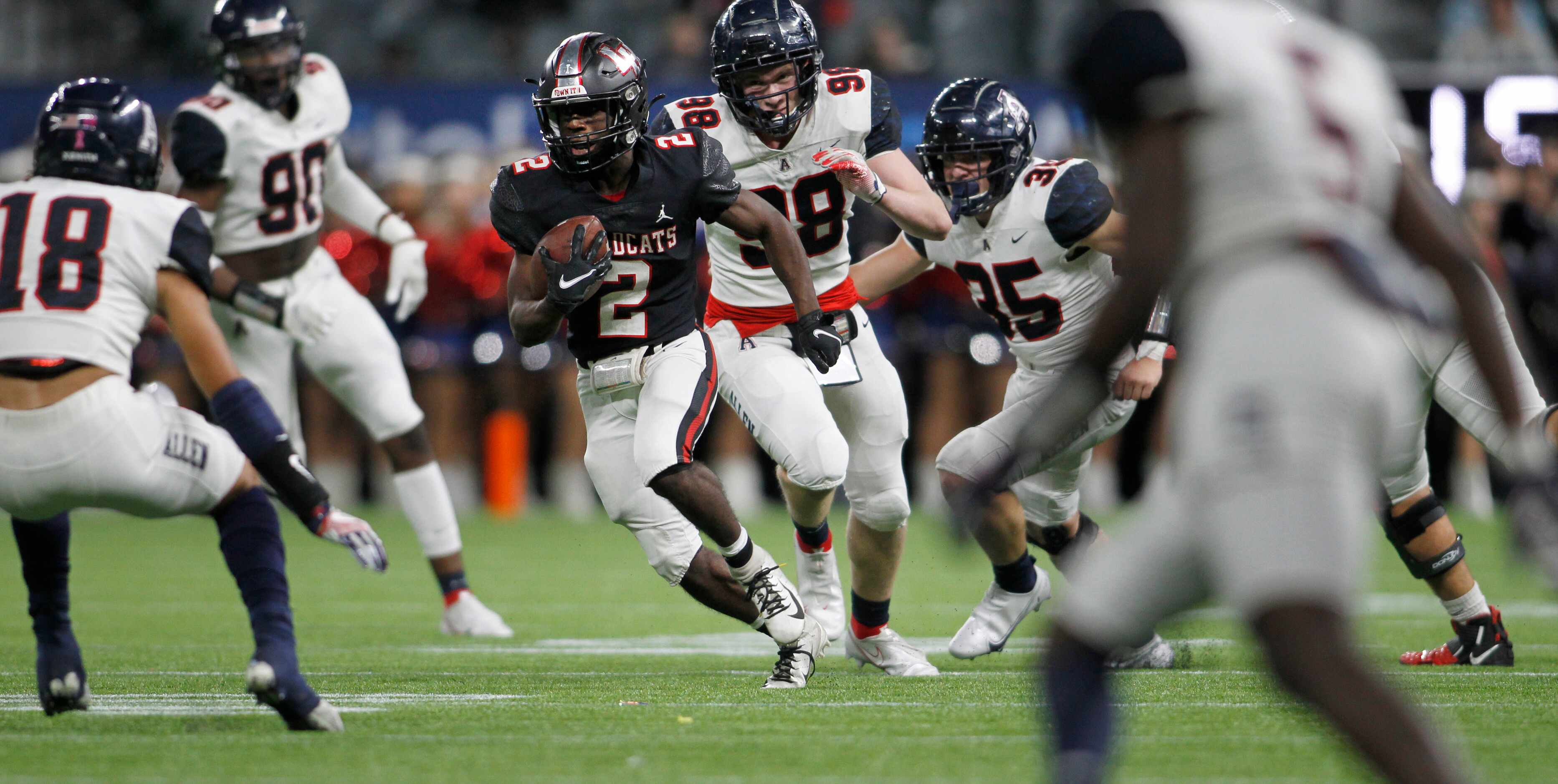 Lake Highlands running back Noelle Whitehead (2) is pursued by Allen defensive lineman Brock...