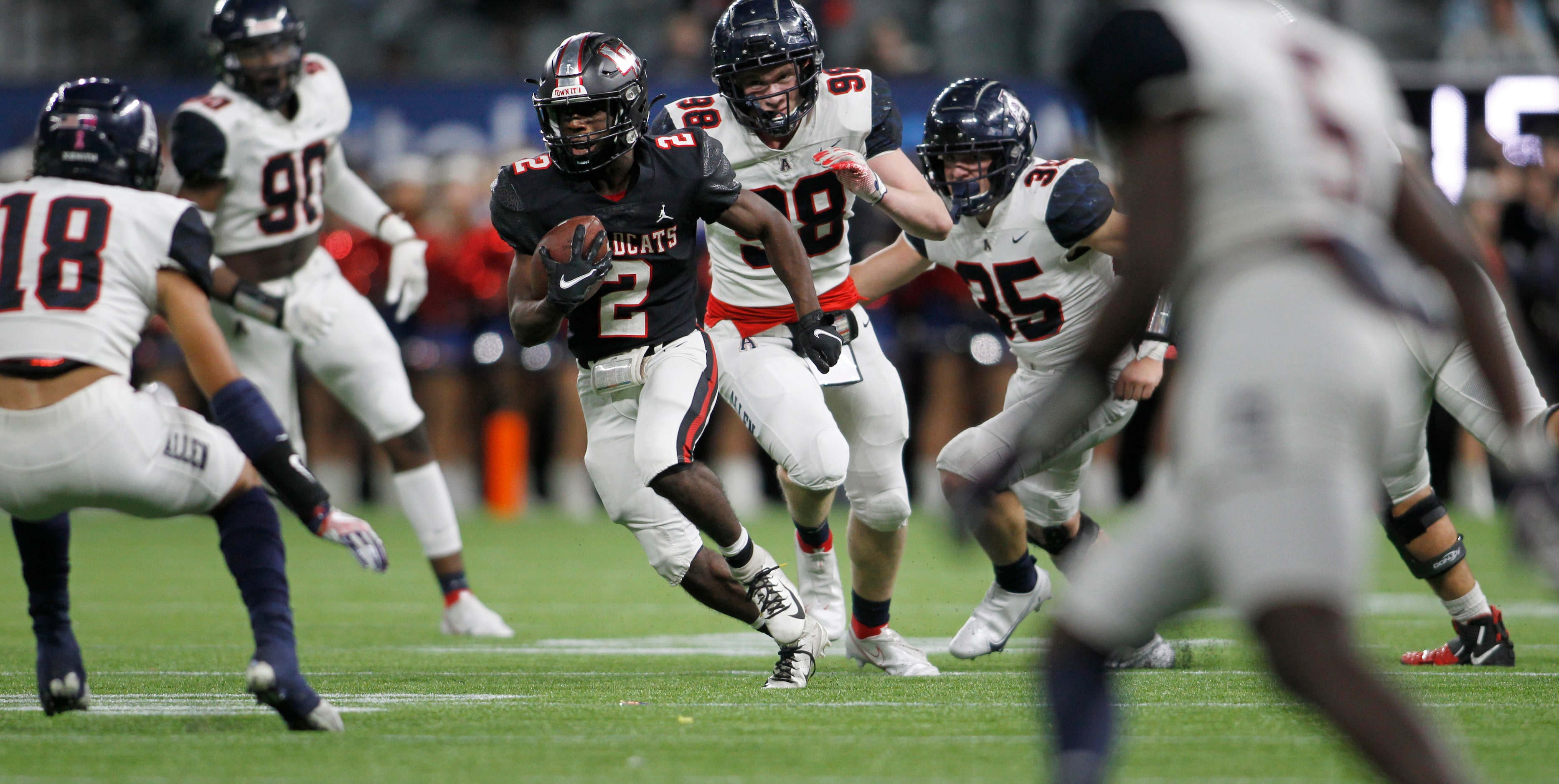 Lake Highlands running back Noelle Whitehead (2) is pursued by Allen defensive lineman Brock...