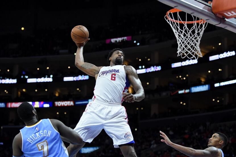 LOS ANGELES, CA - APRIL 13: DeAndre Jordan #6 of the Los Angeles Clippers attempts an...