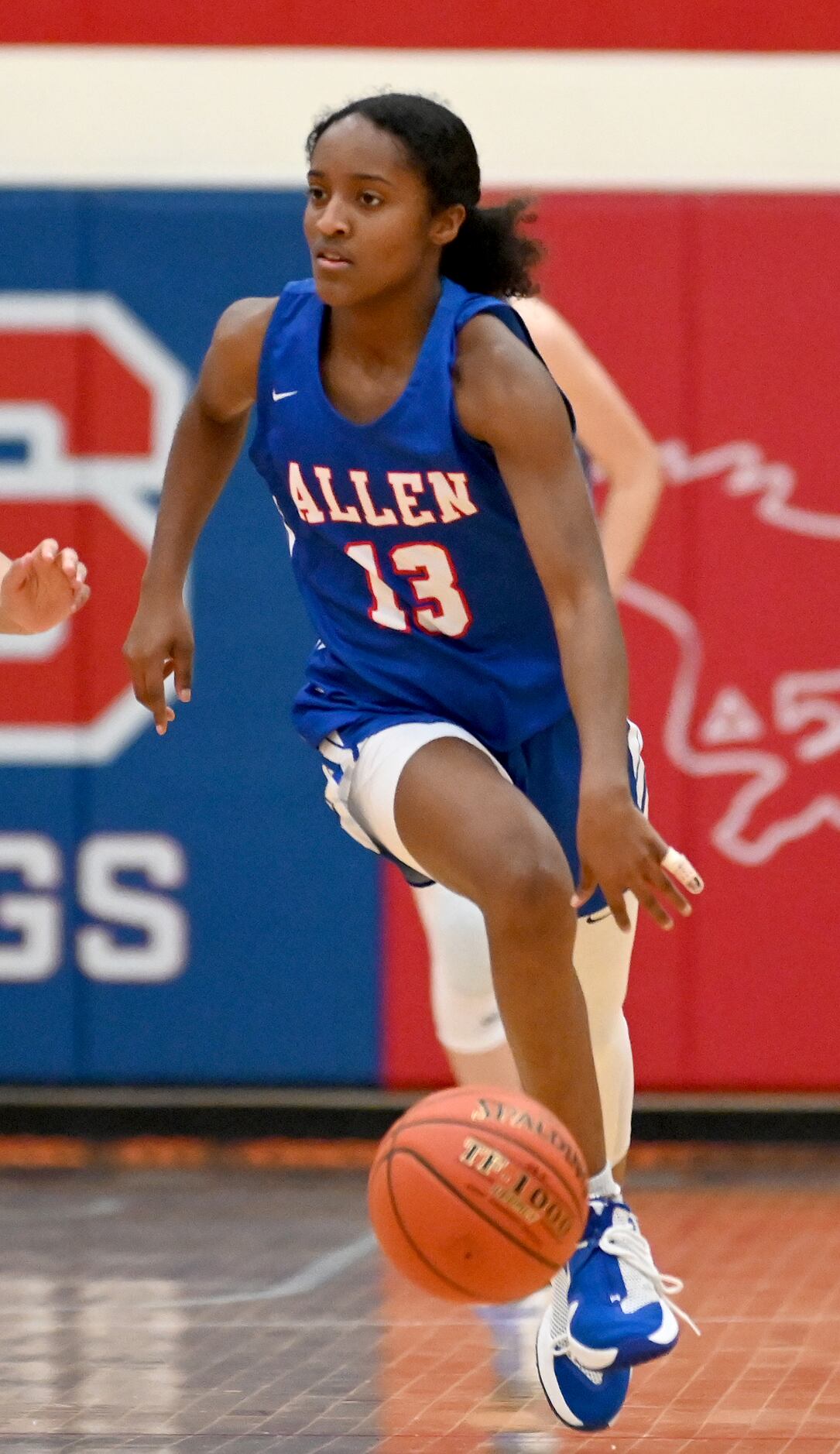 Allen’s Zoe Jackson brings the ball up court in the second half of a Class 6A girls high...