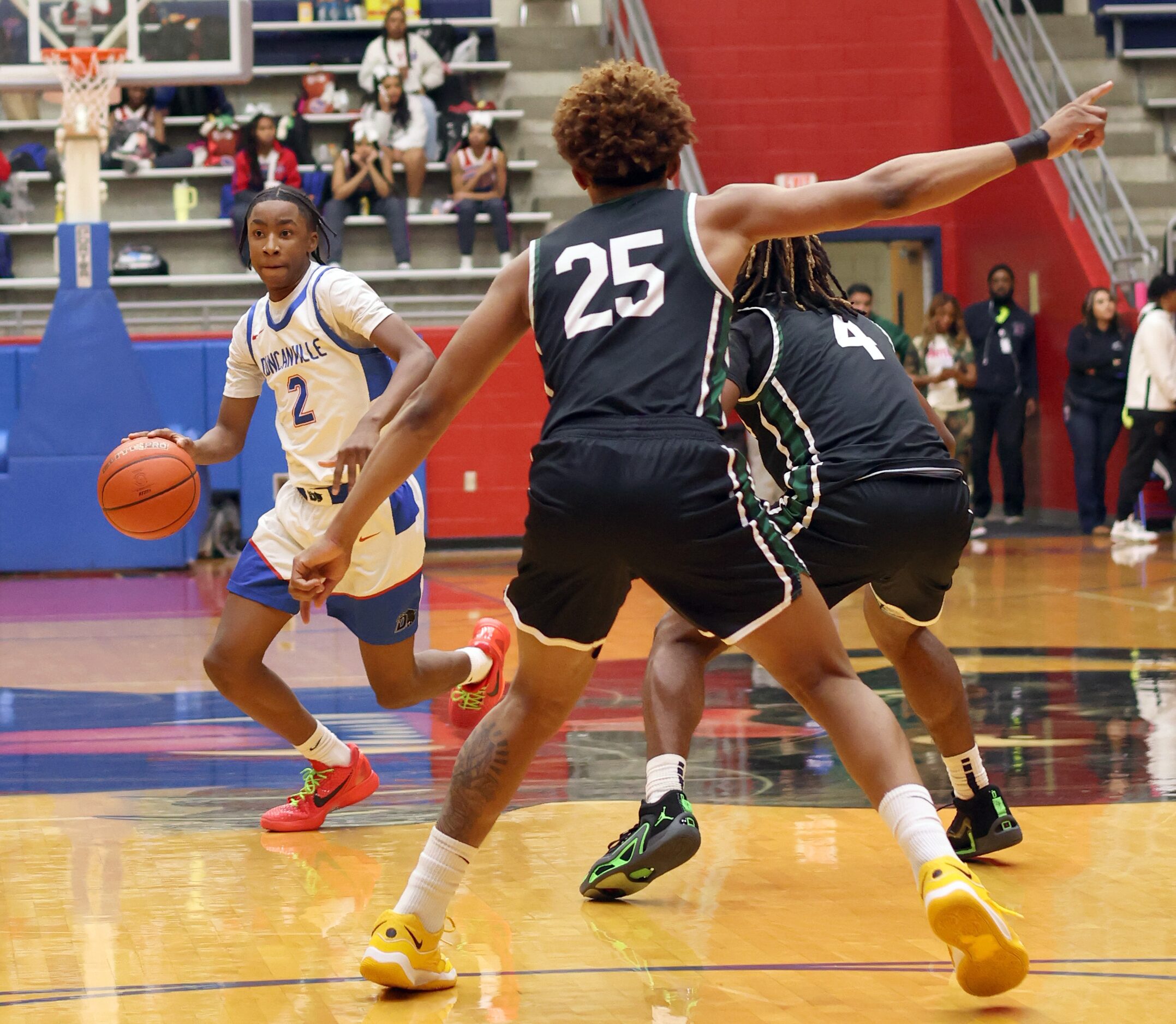 Duncanville guard Christopher Hunt Jr. (2) brings the ball past half-court as DeSoto's...