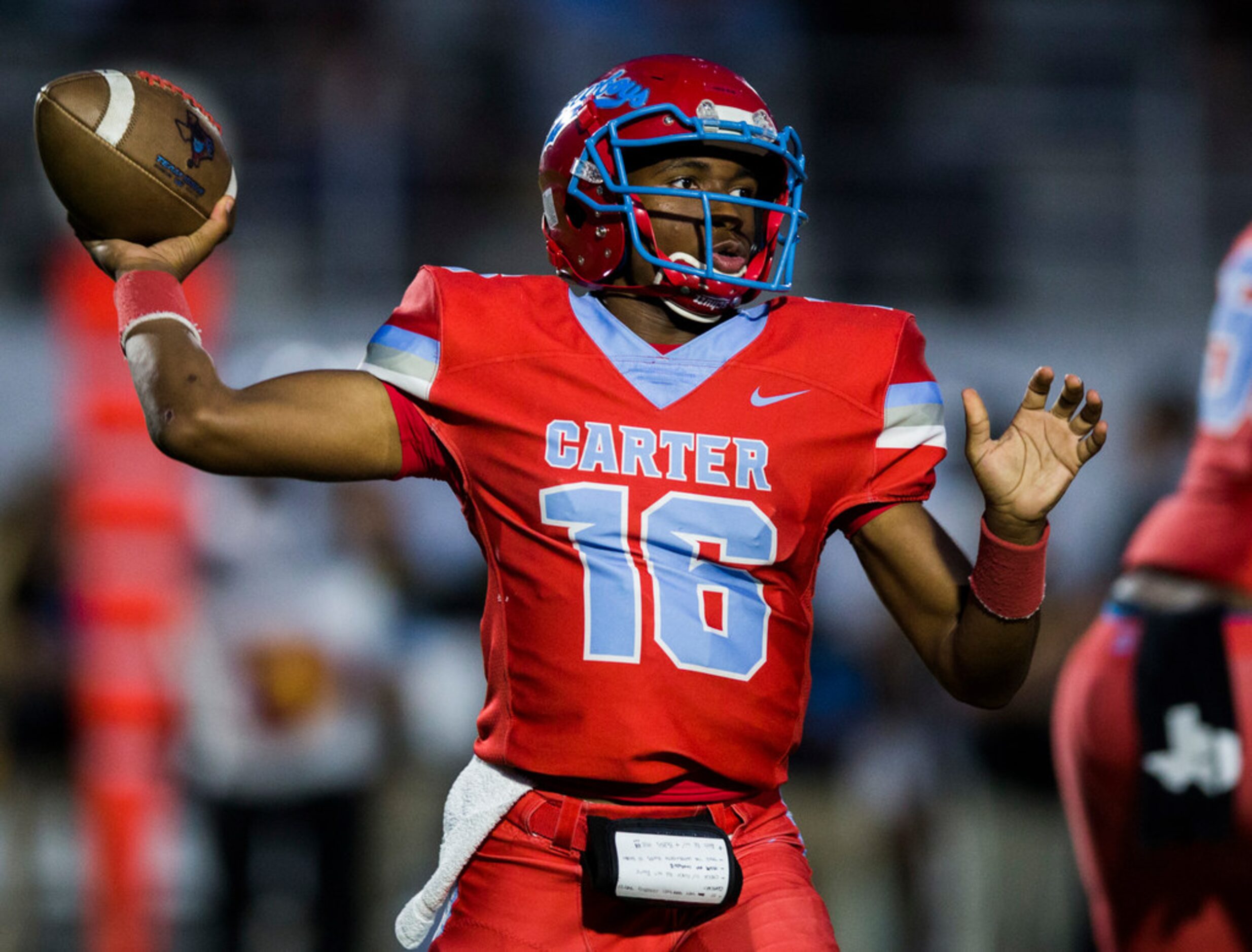 Carter quarterback Kace Williams (16) throws a pass during the first quarter of a 4A high...