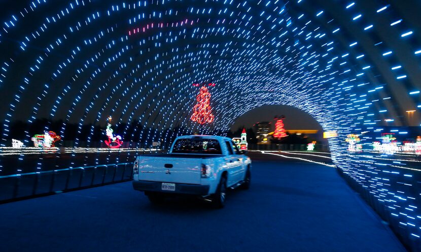 A truck drives through the new Radiance! lights display at the Dr Pepper Ballpark in Frisco.