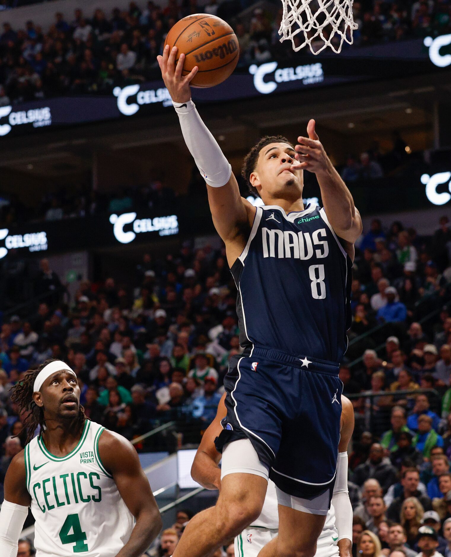 Dallas Mavericks guard Josh Green (8) attempts a layup during the second half of an NBA game...