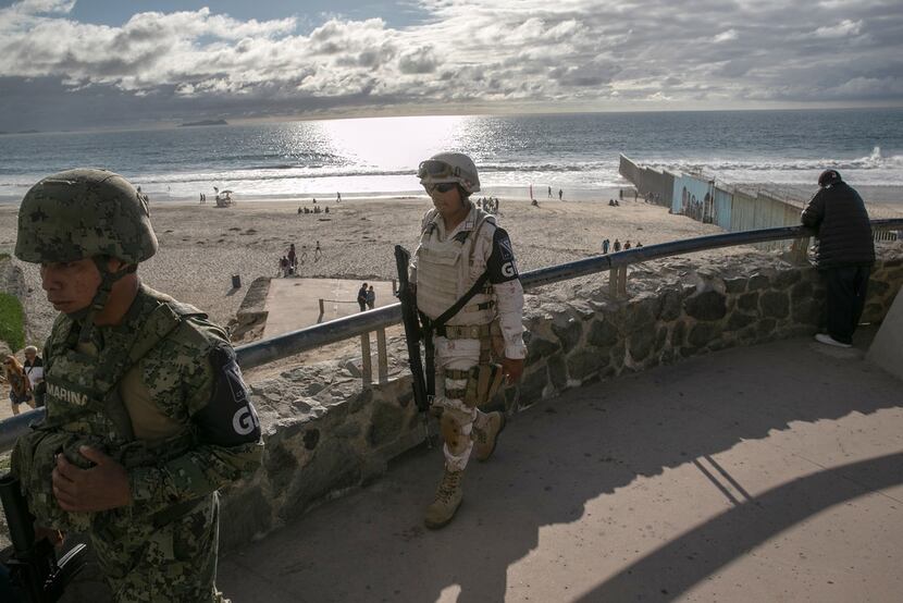 Mexican National Guard soldiers patrol near the border fence with the United States on...