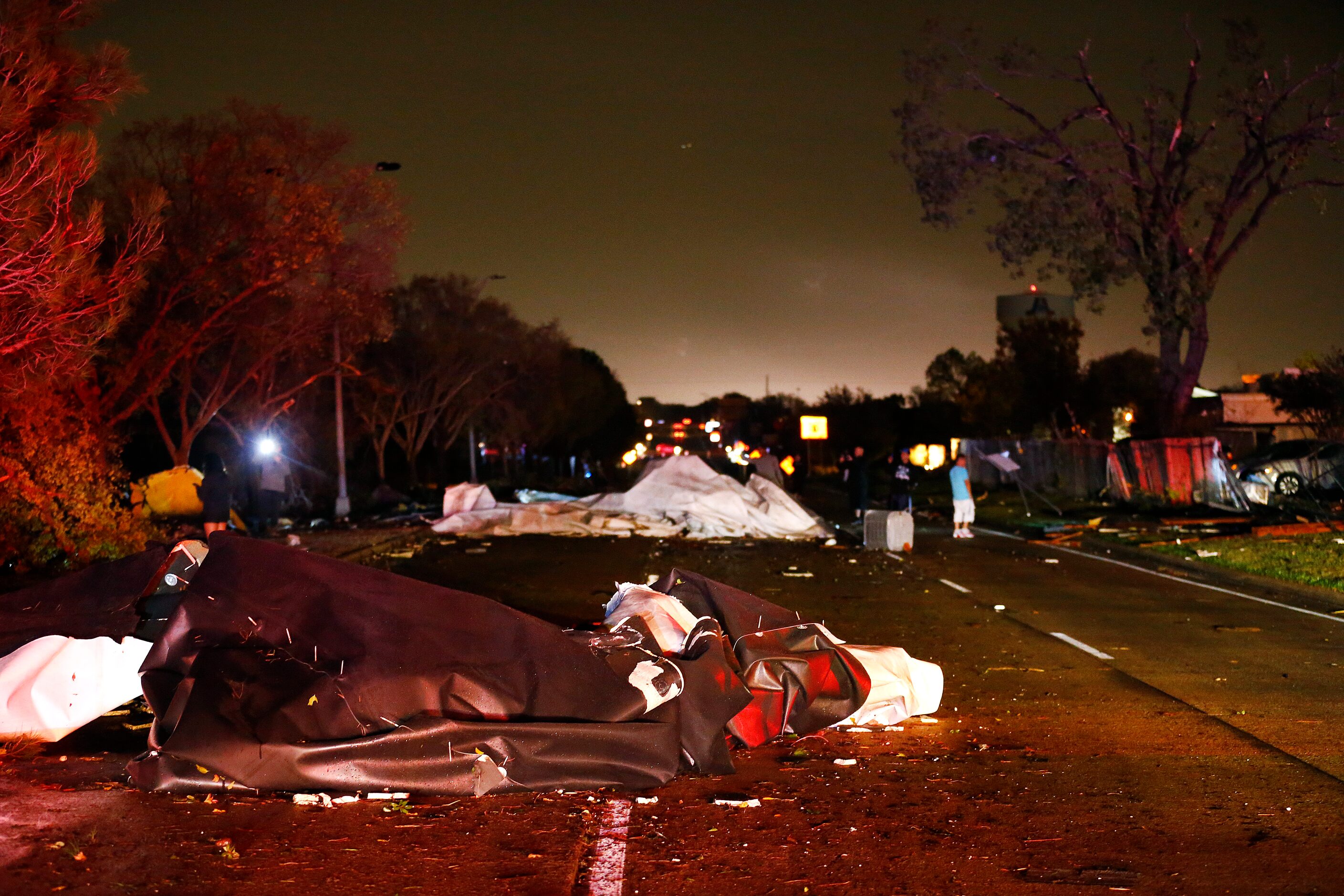 Roofs from The Mirage Apartments complex were torn off and landed on Pioneer Parkway in...