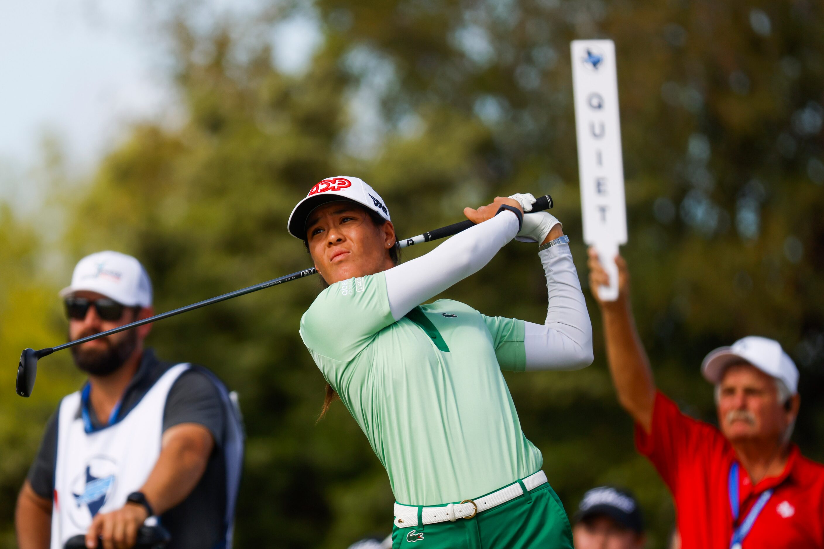 Celine Boutier of France watches as she tees off on the ninth hole during the first round of...