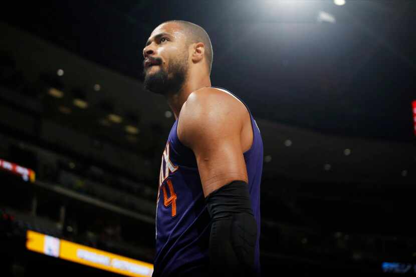 Phoenix Suns center Tyson Chandler walks off the court after being ejected for arguing with...