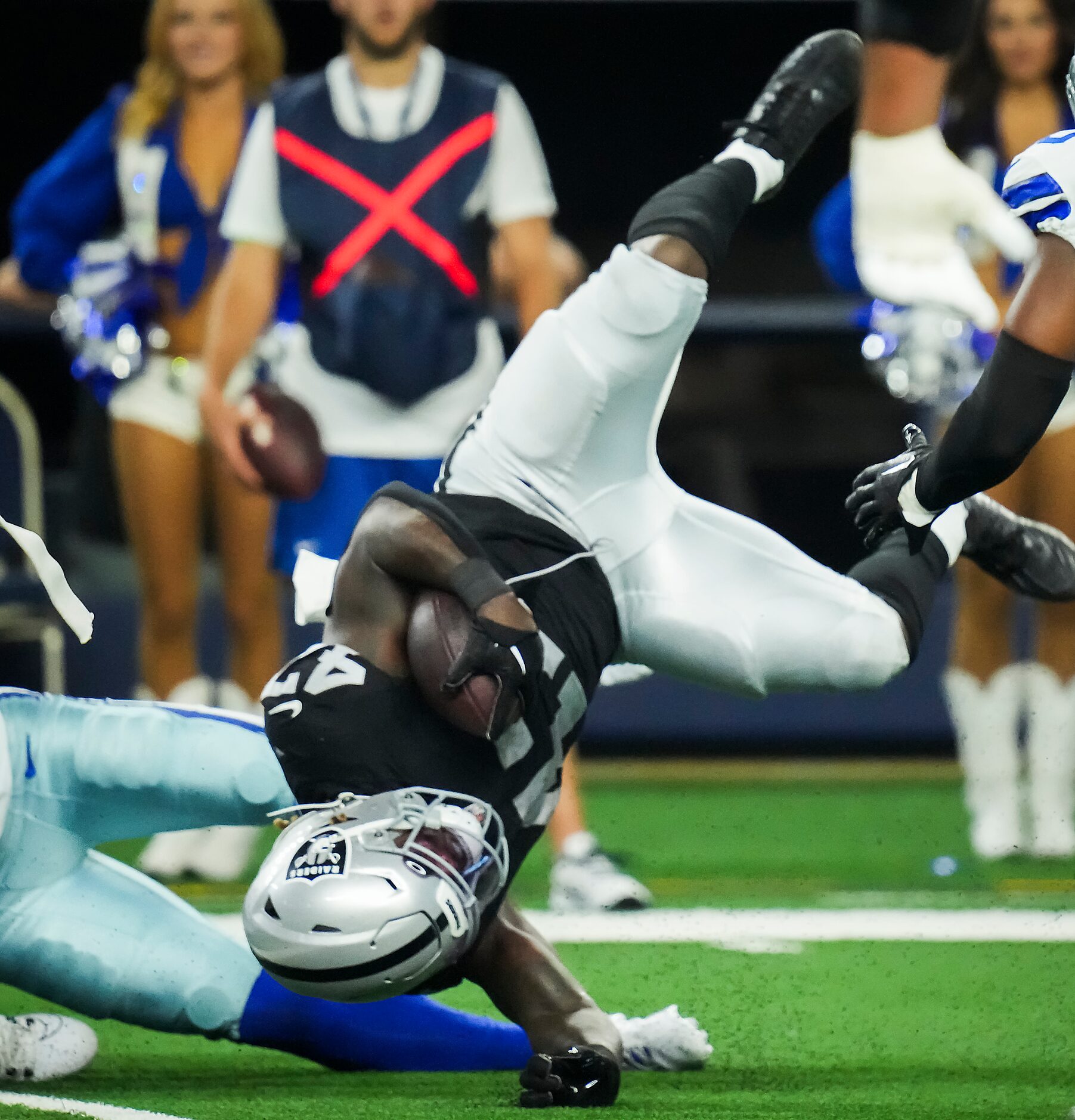 Las Vegas Raiders running back Sincere McCormick (47) is upended during the second half of...