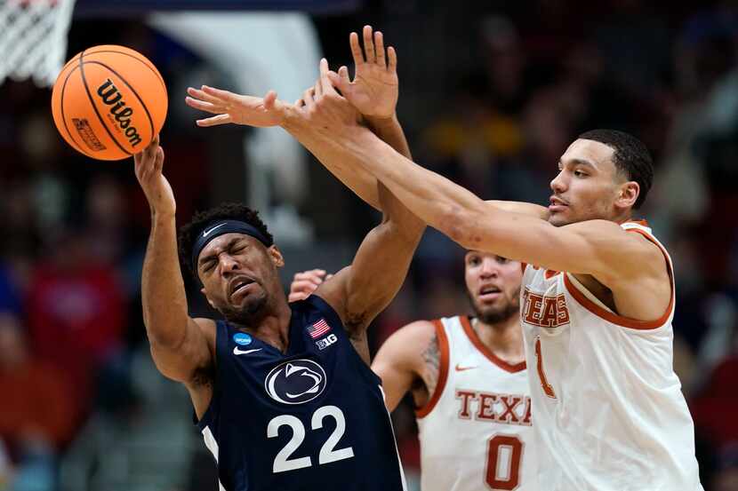 Penn State guard Jalen Pickett (22) is fouled by Texas forward Dylan Disu (1) in the first...
