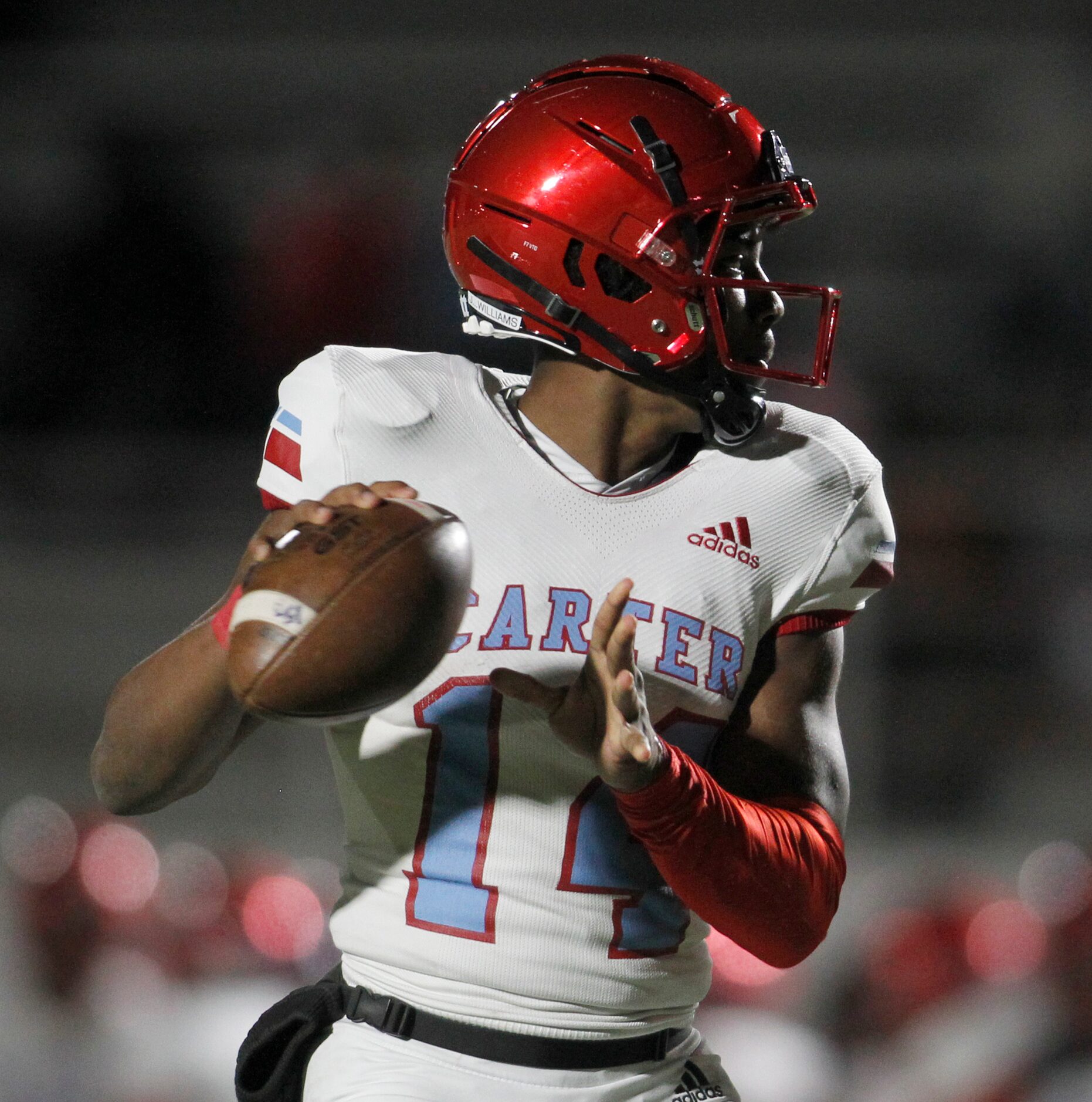 Dallas Carter quarterback J'Dyn Williams (14) looks to pass during 2nd quarter action of...