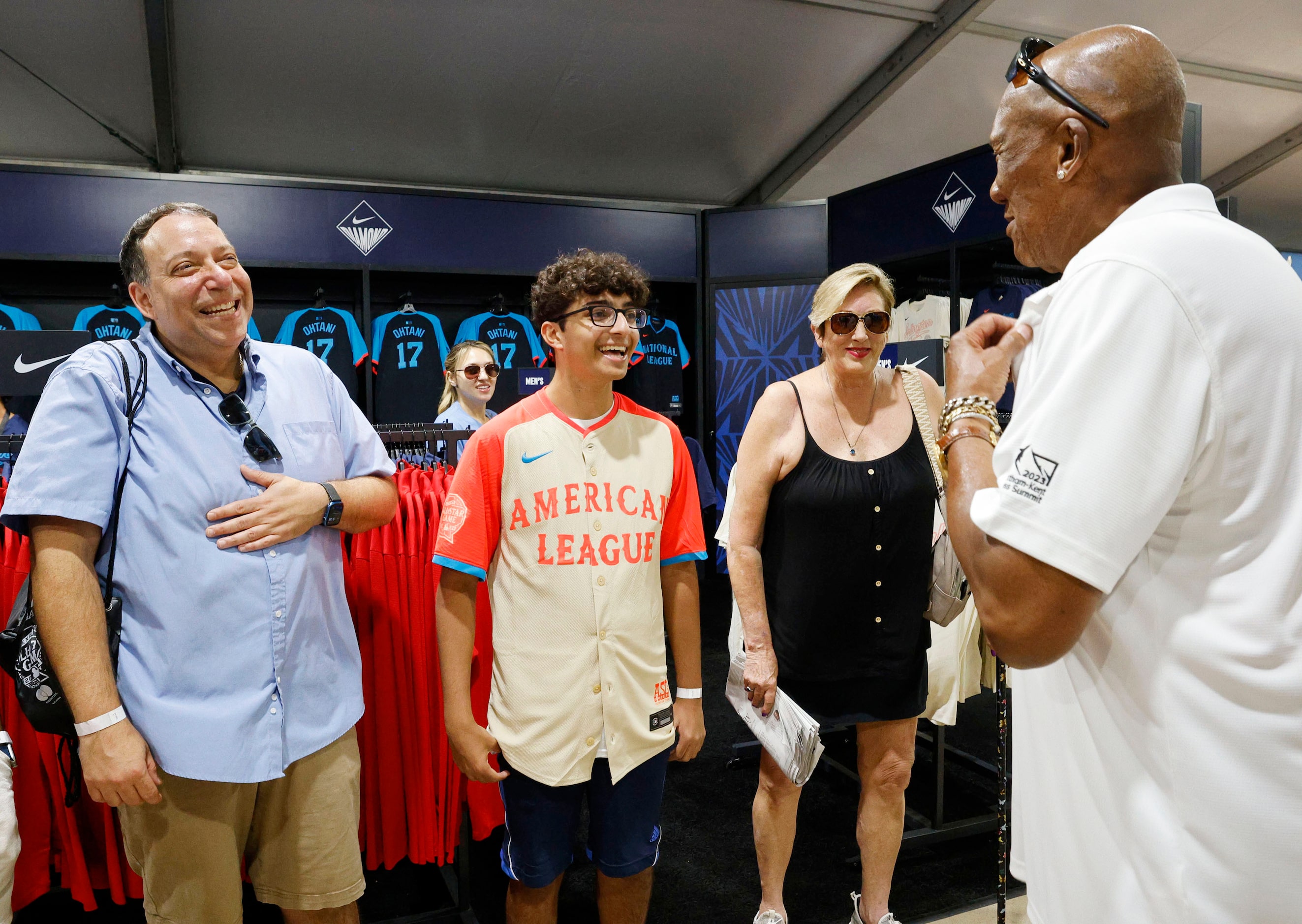 Make-a-Wish kid Devan Huber , 16, of Demarest N.J., second from left, and his father Michael...