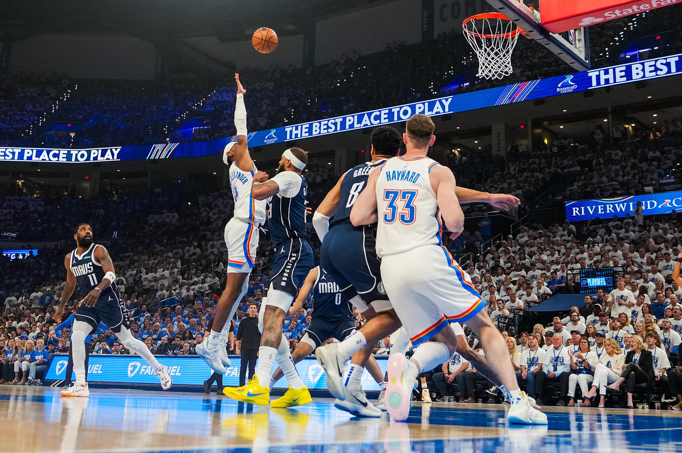 Oklahoma City Thunder guard Shai Gilgeous-Alexander (2) shoots over Dallas Mavericks center...