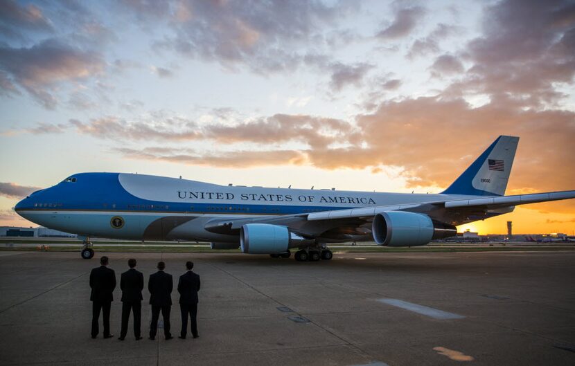  Secret Service agents watch Air Force One depart Dallas Love Field on Saturday. (Ashley...