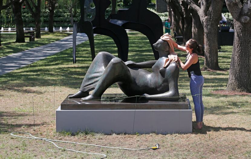 The grass around sculptor Henry Moore's Reclining Figure looks mostly dead as Nicole...