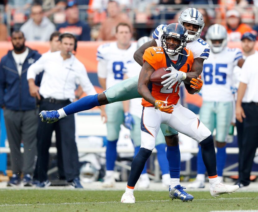 Dallas Cowboys wide receiver Dez Bryant (88) knocks the ball away from Denver Broncos...