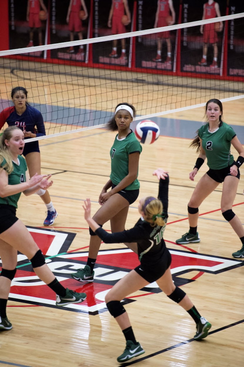 Southlake Carroll defensive specialist Brayden Gruenewald tries to return a hit against...