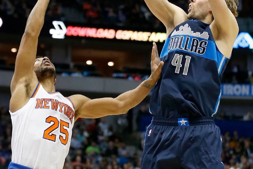 Dallas Mavericks forward Dirk Nowitzki (41) shoots over New York Knicks guard Derrick Rose...