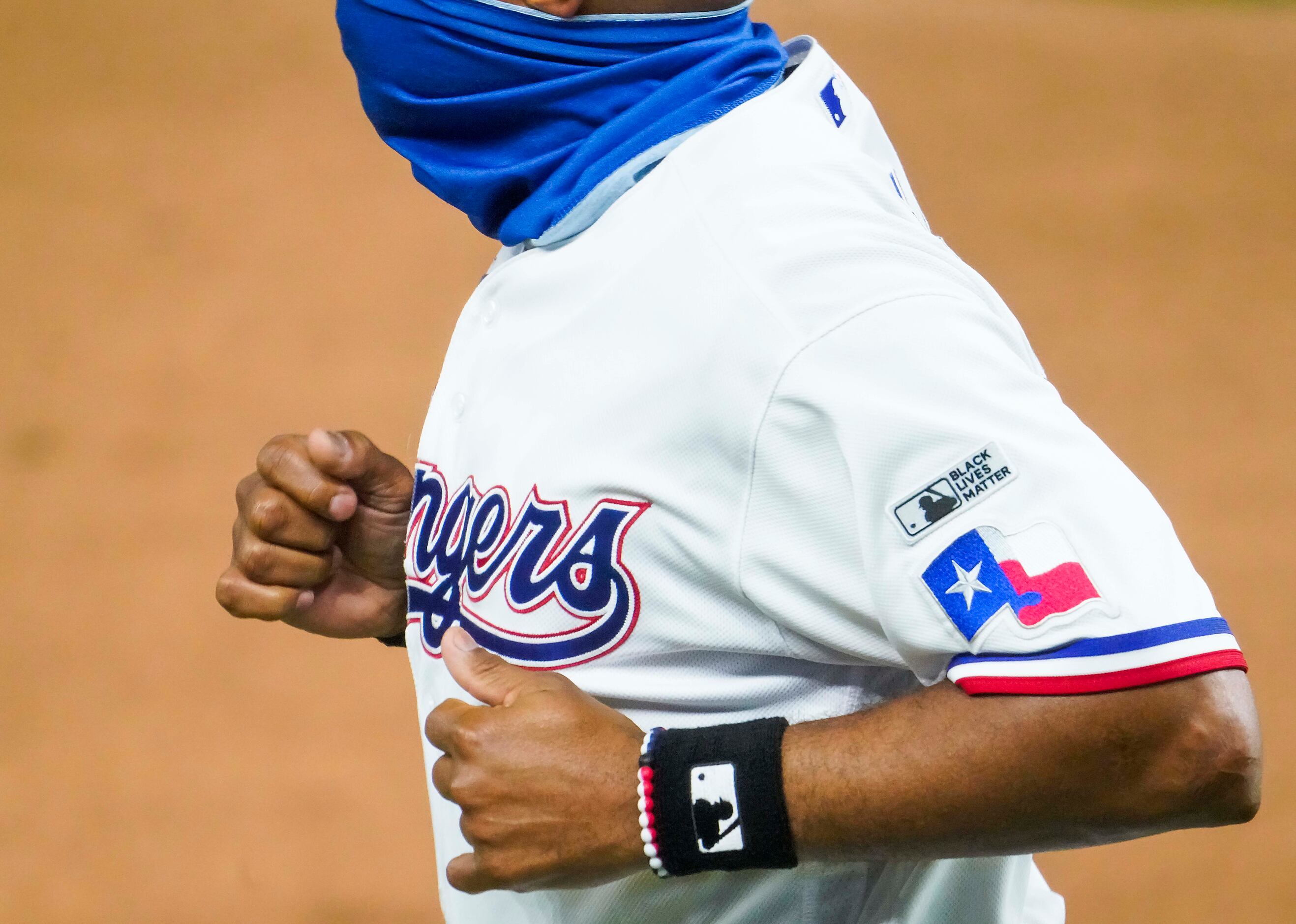 A Black Lives Matter patch is seen on the sleeve of Texas Rangers third base coach Tony...