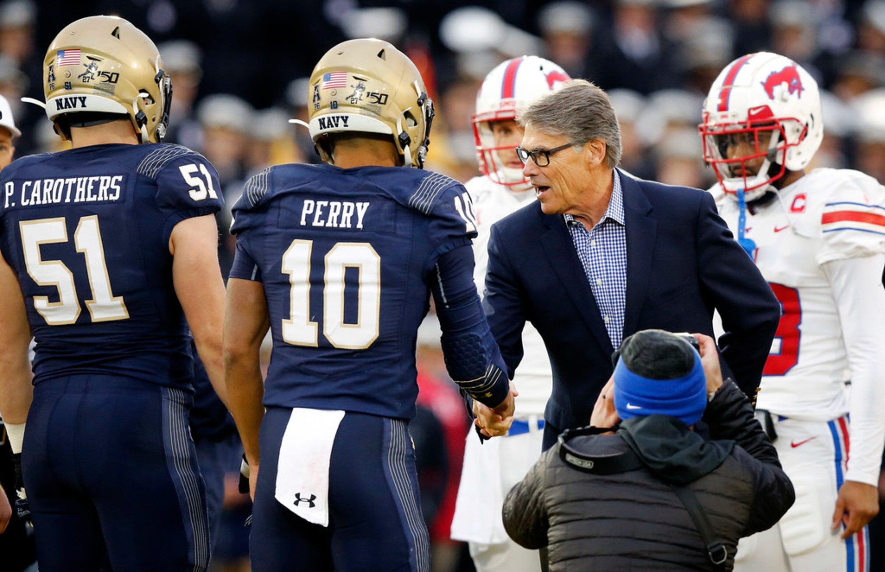 Department of Energy Secretary Rick Perry shakes hands with Navy Midshipmen captain Malcolm...