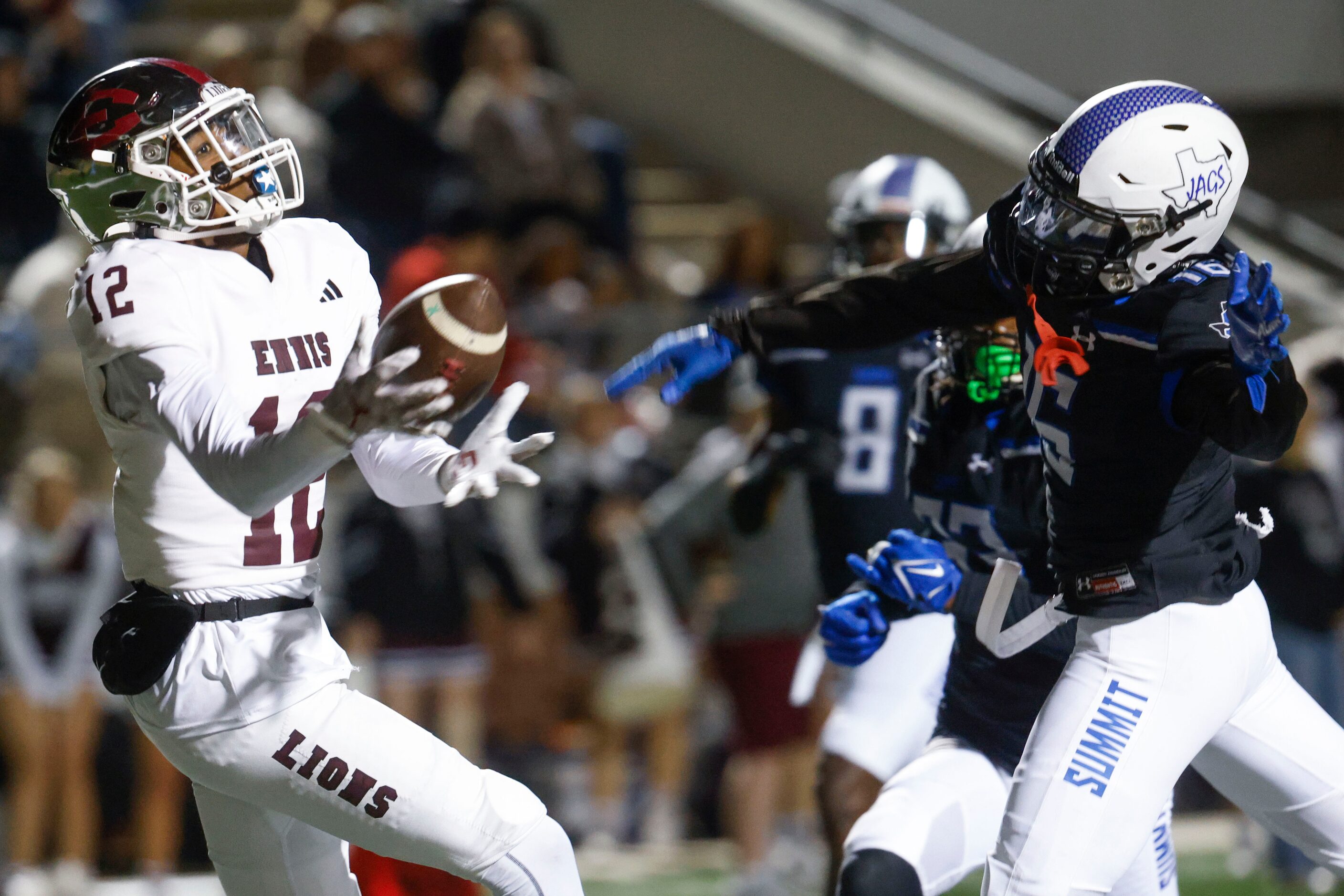 Ennis High’s Taurean Bell (12) receives a touchdown pass past Mansfield Summit high DaVaughn...