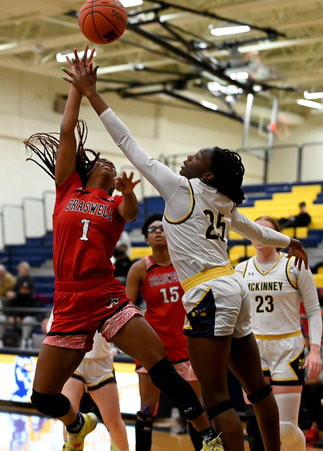 Braswell’s Journey Taylor (1) shoots over McKinney’s Skylar Anamekwe (25) in the second half...