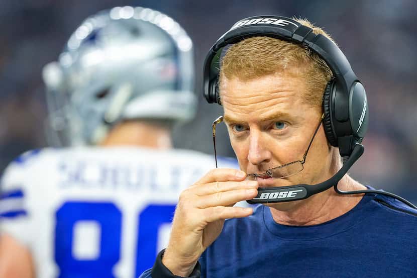 Dallas Cowboys head coach Jason Garrett adjusts his glasses during a time out in the first...