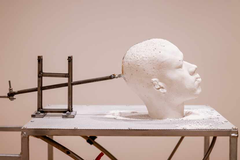 Jeffrey Meris’ “A Still Tongue Keeps A Wise Head,” is made with a plaster casting of his own...