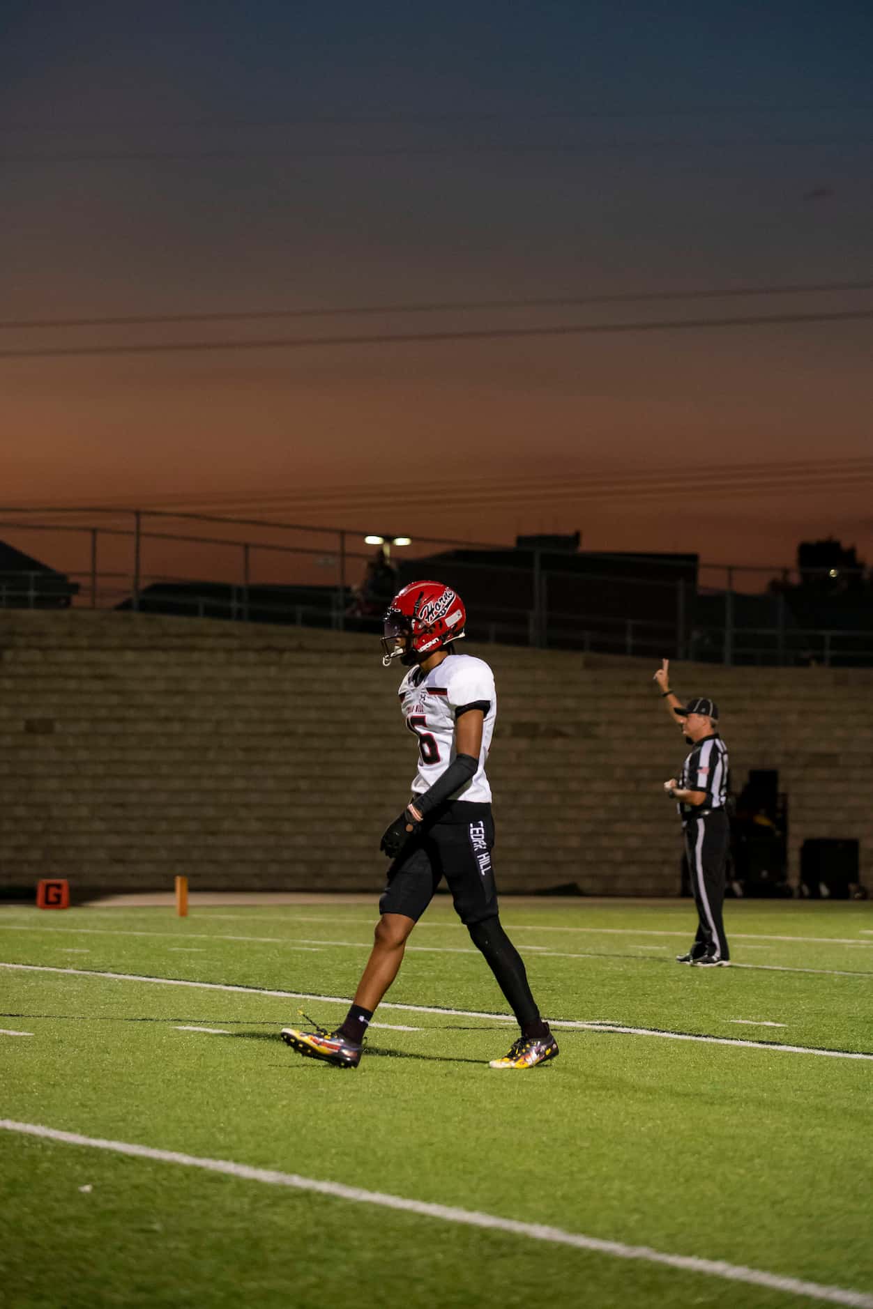 Cedar Hill junior Javione Joy (16) walks back to the line of scrimmage after a play during a...