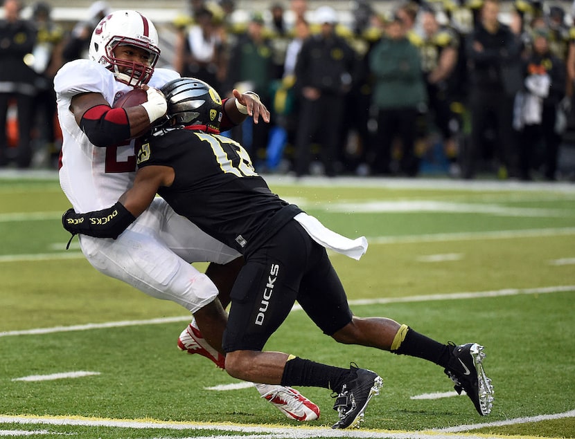 EUGENE, OR - NOVEMBER 1: Defensive back Troy Hill #13 of the Oregon Ducks tackles running...