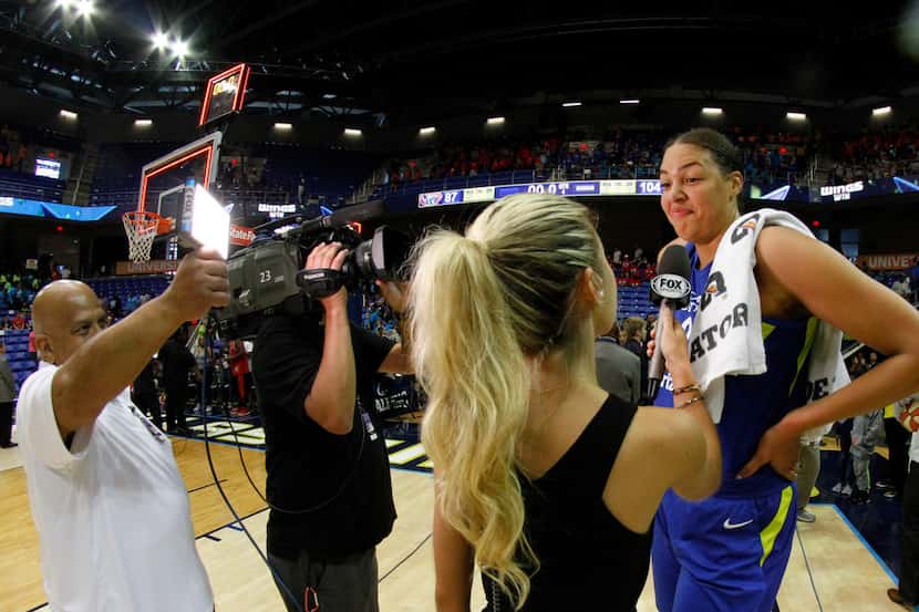 Dallas Wings center Liz Cambage (8) is interviewed following her WNBA record setting...