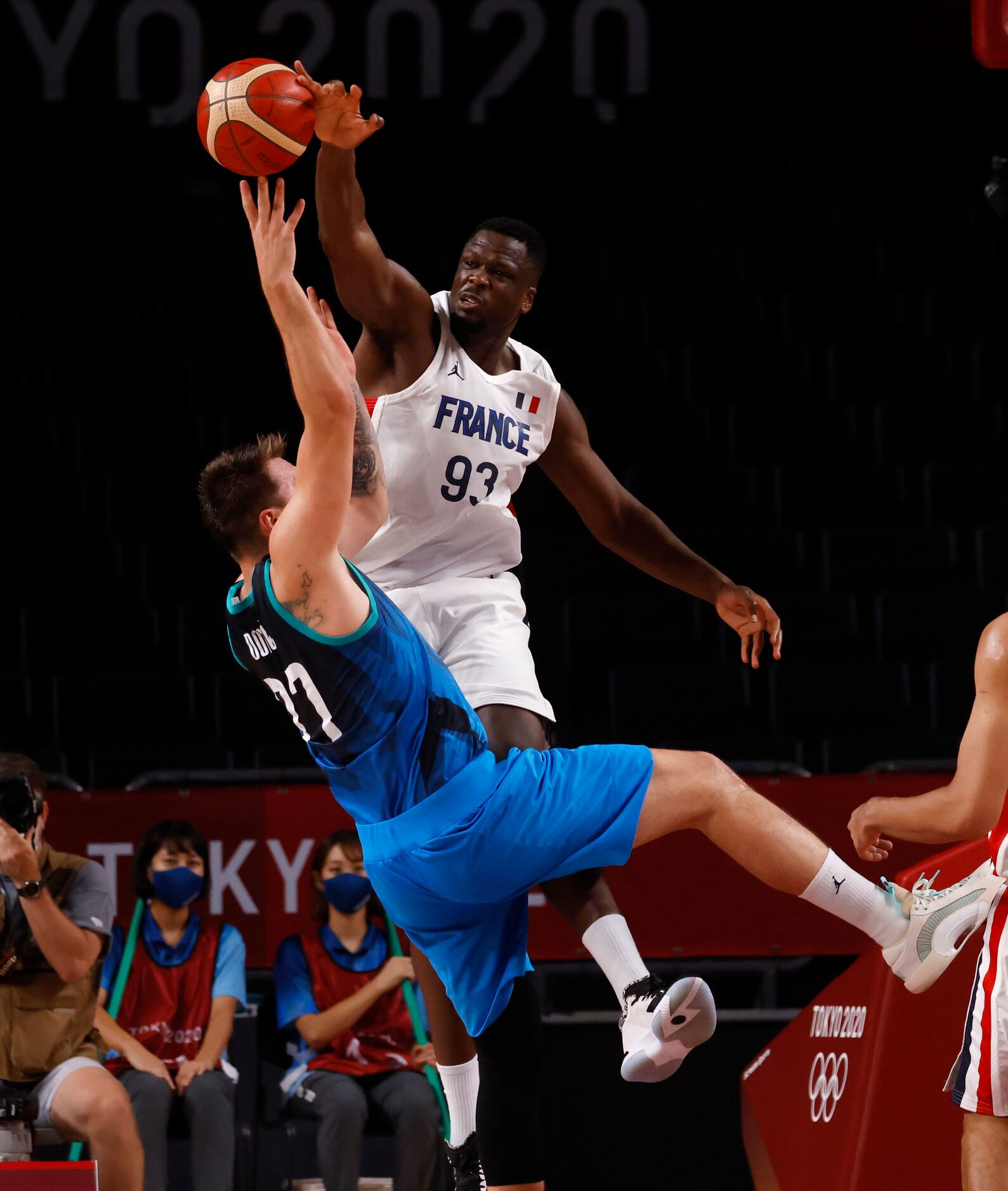 Slovenia’s Luka Doncic (77) is fouled by France’s Moustapha Fall (93) during the second half...