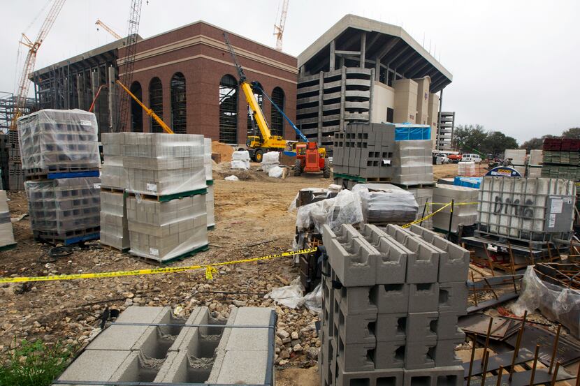 Construction material sits outside as a crew worka on the redevelopment of Kyle Field in...