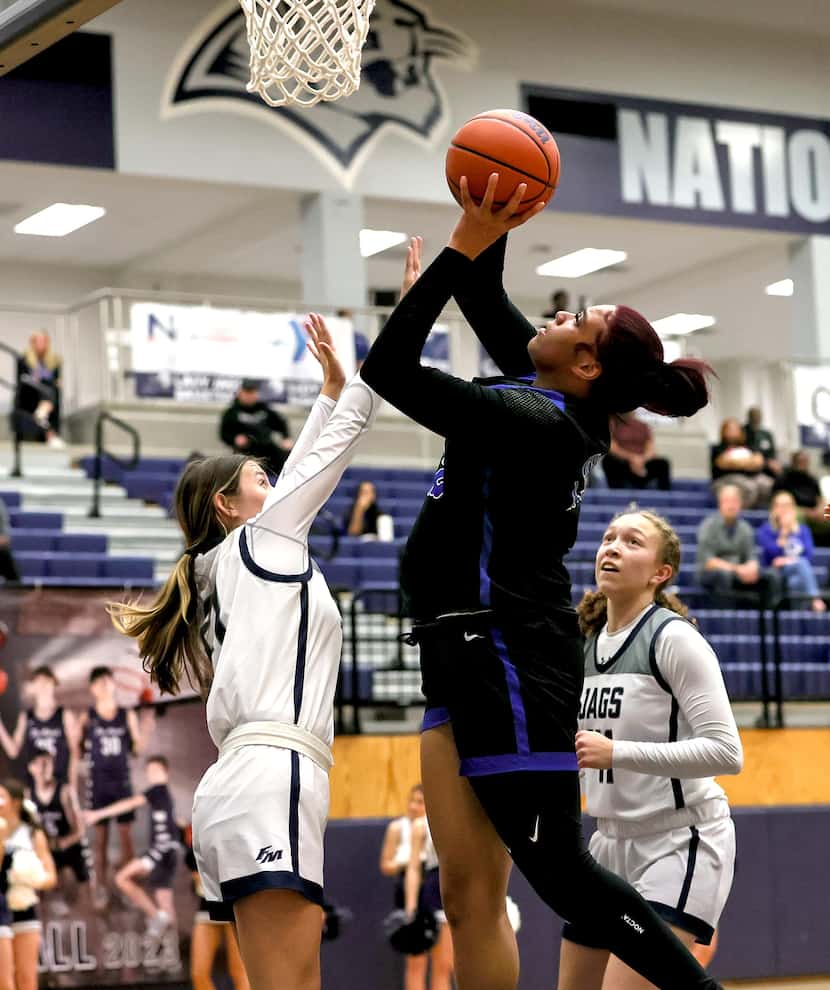 Hebron forward Jordan Thomas goes up for a shot against Flower Mound on January 10, 2023 at...