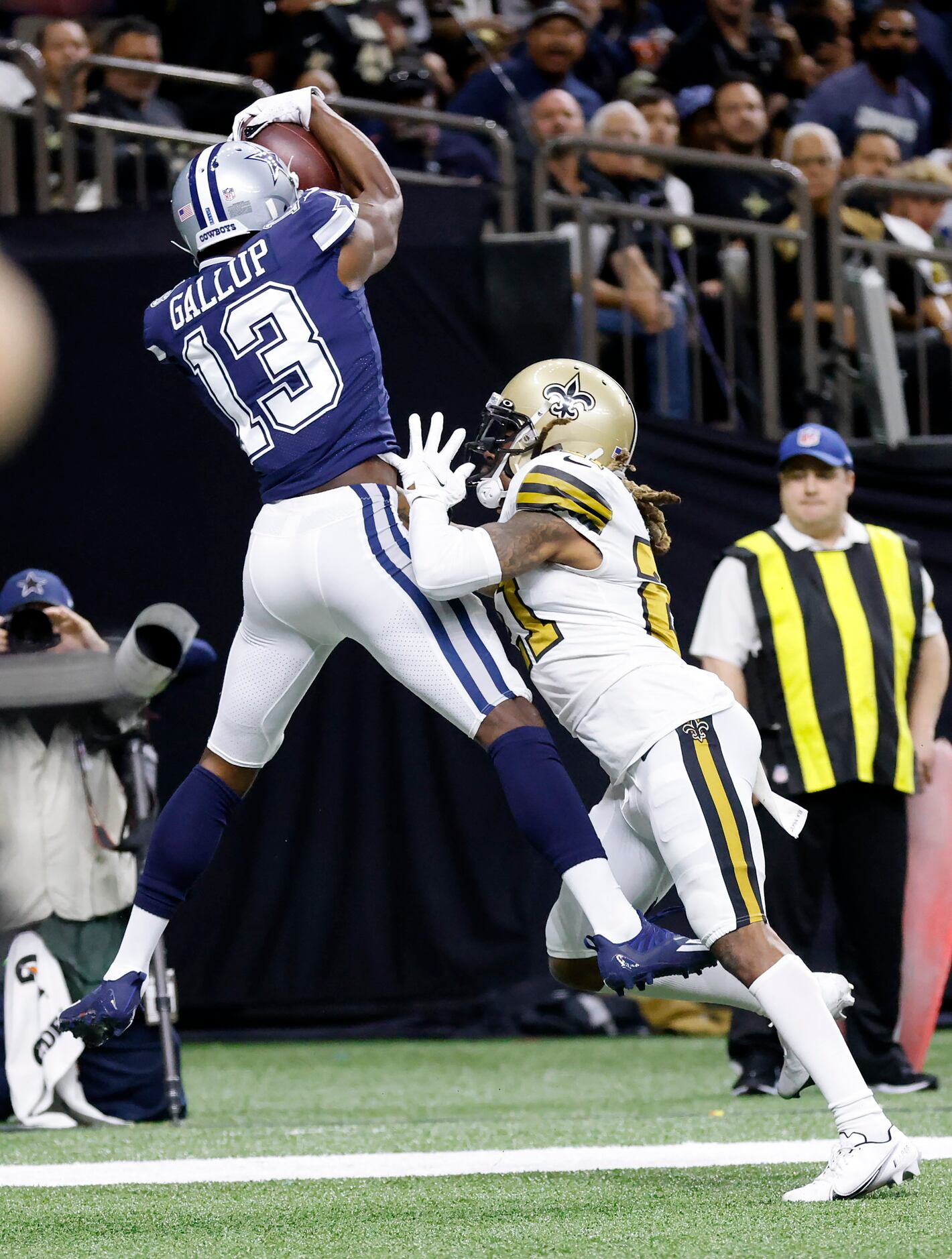 Dallas Cowboys wide receiver Michael Gallup (13) goes high for a first quarter touchdown...