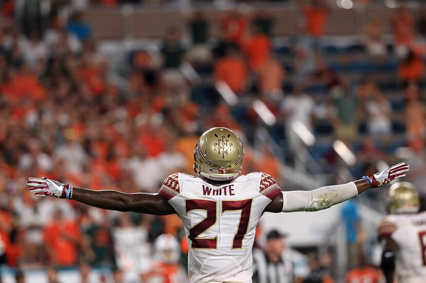 MIAMI GARDENS, FL - OCTOBER 08: Marquez White #27 of the Florida State Seminoles reacts to a...