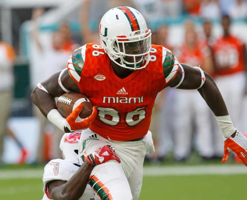FILE - In this Sept. 10, 2016, file photo, Miami tight end David Njoku (86) is tackled by...