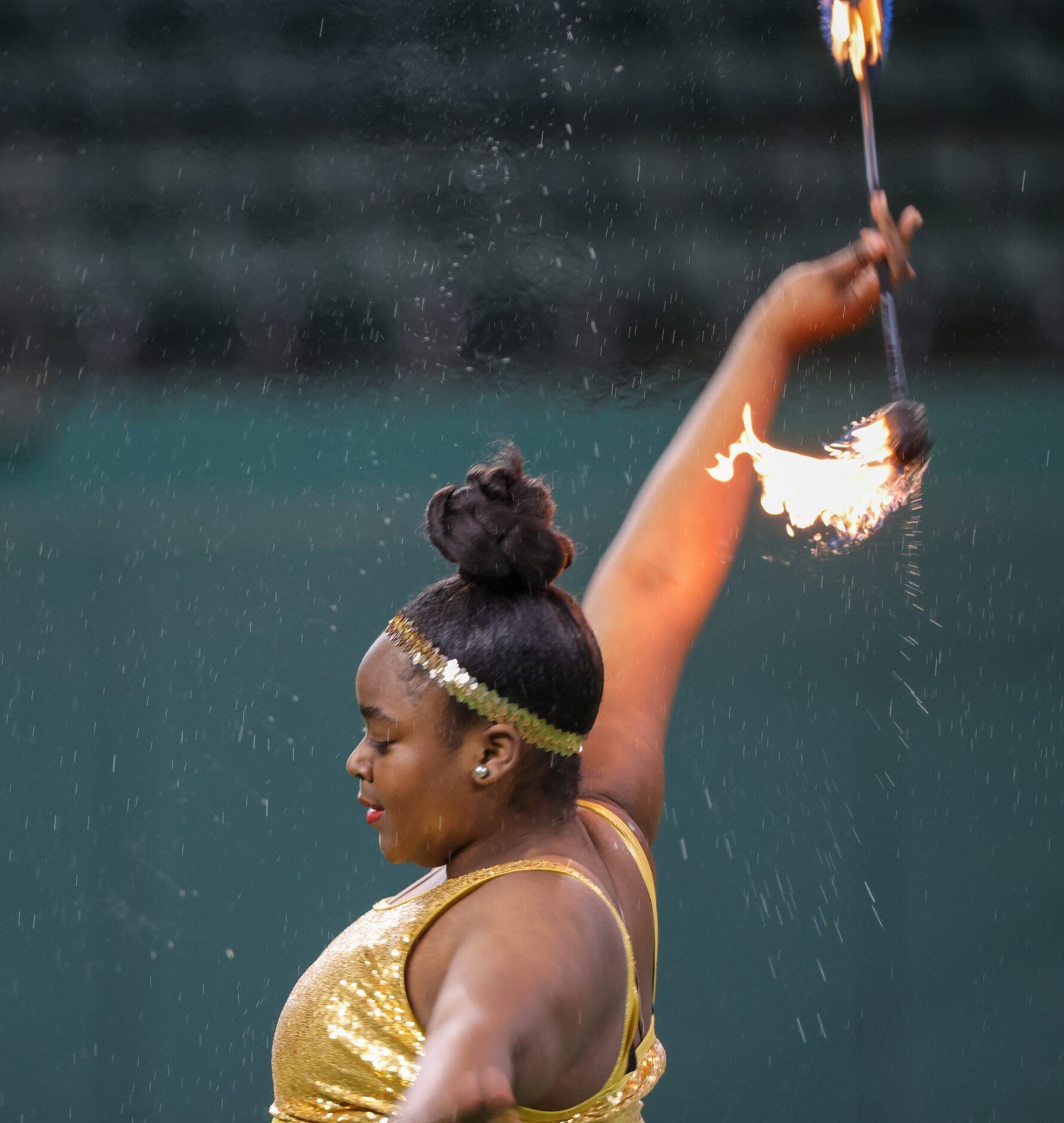 A member of the Sophisticated Soul Majorette Line performs with the South Oak Cliff High...