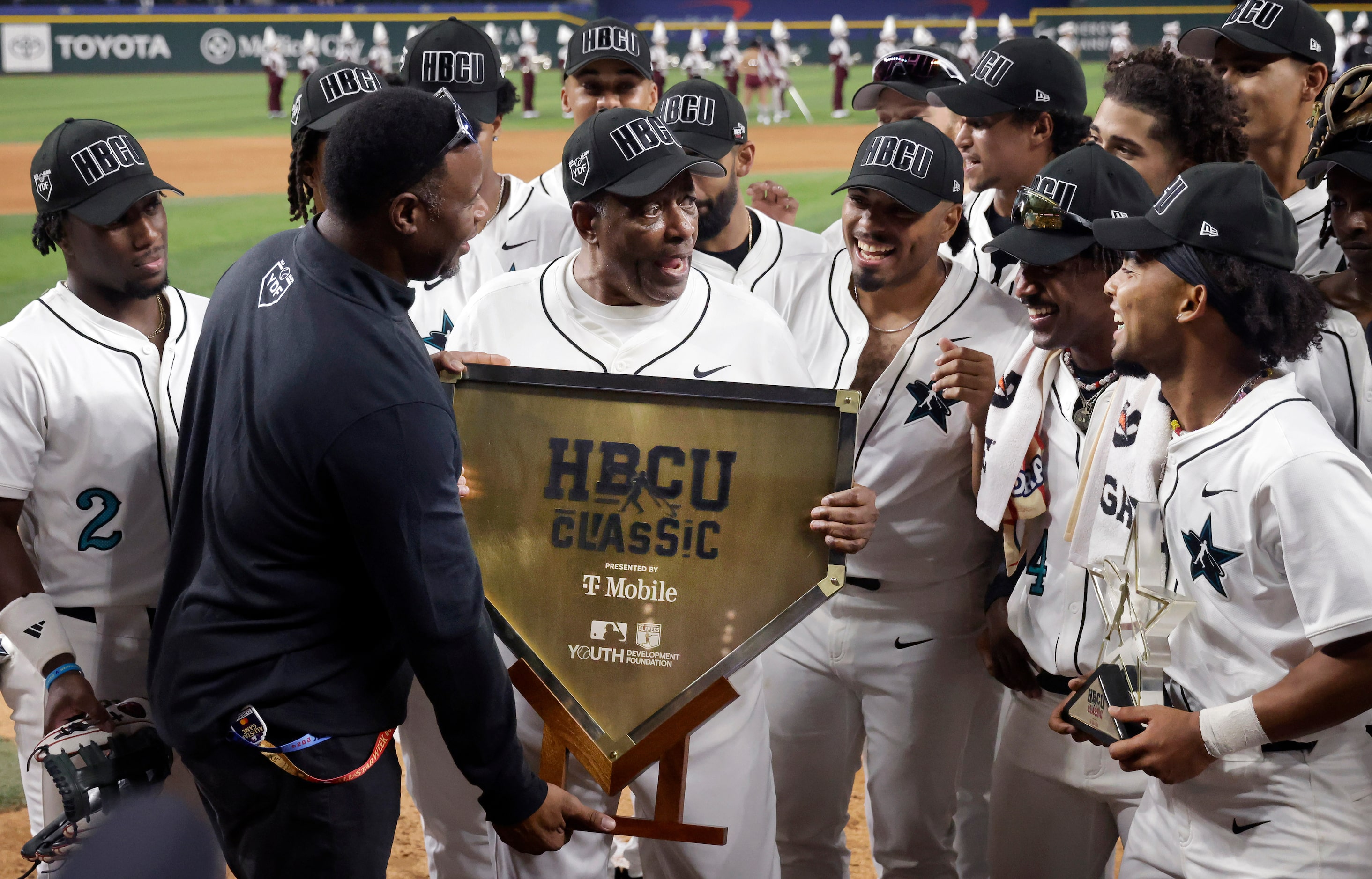 MLB-MLBPA Youth Development Foundation Global Ambassador Ken Griffey Jr. (left) presents...