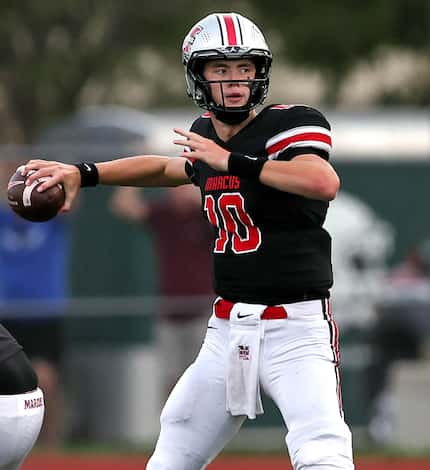 Flower Mound Marcus quarterback Cole Welliver attempts a pass against Southlake Carroll...