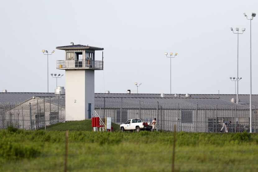 An inmate works outdoors at a Texas prison unit in Huntsville last year.