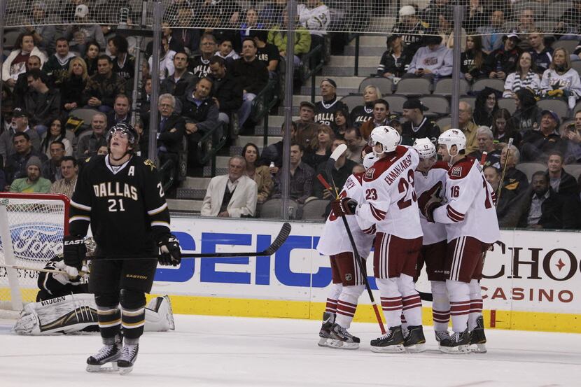The Phoenix Coyotes celebrate a second goal against the Dallas Stars in the second period of...