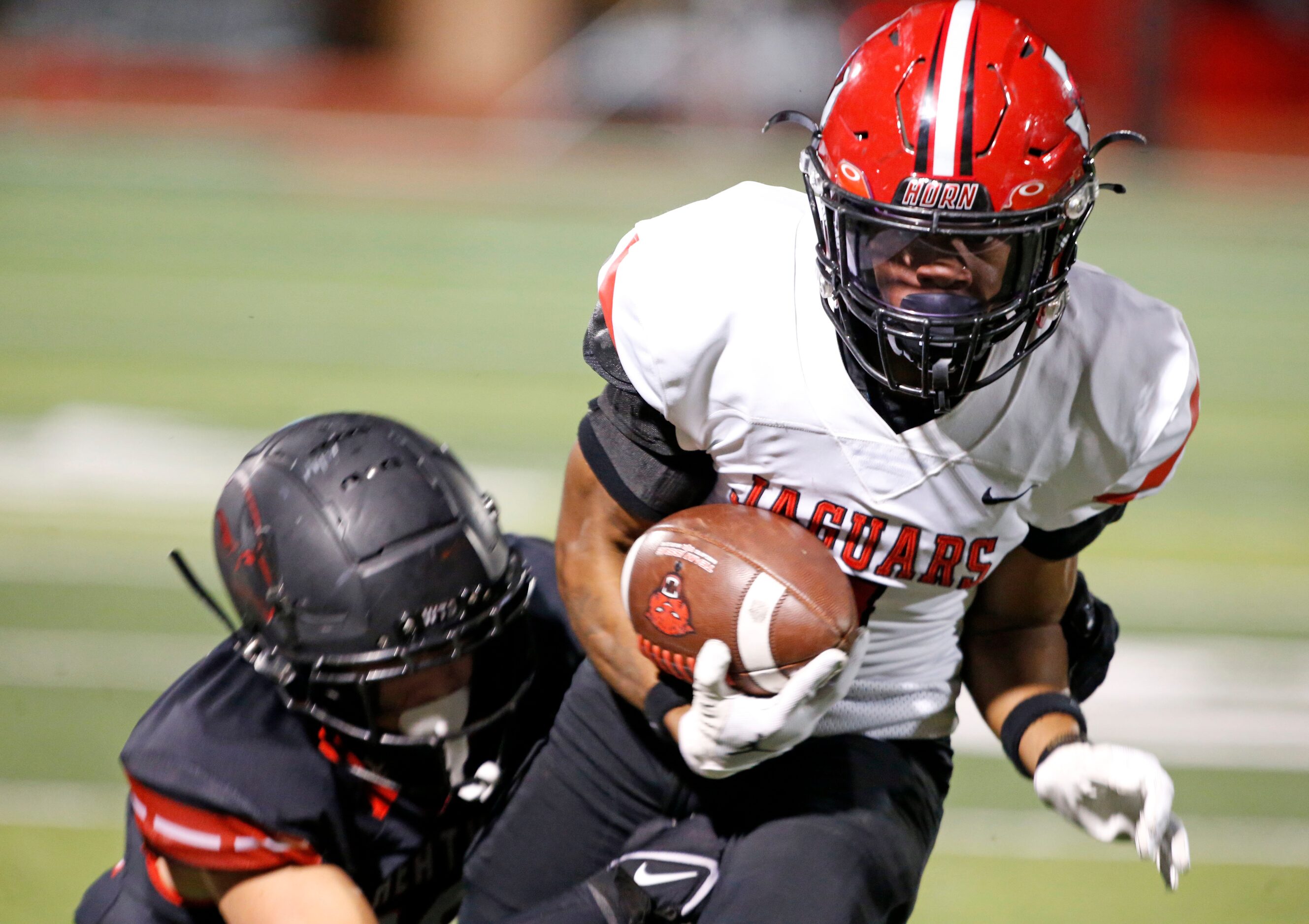 Mesquite Horn’s Chris Dawn (1) catches a touchdown pass over Rockwall Heath defender Stosh...